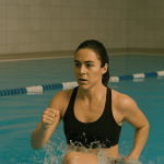Woman doing HIIT pool workout